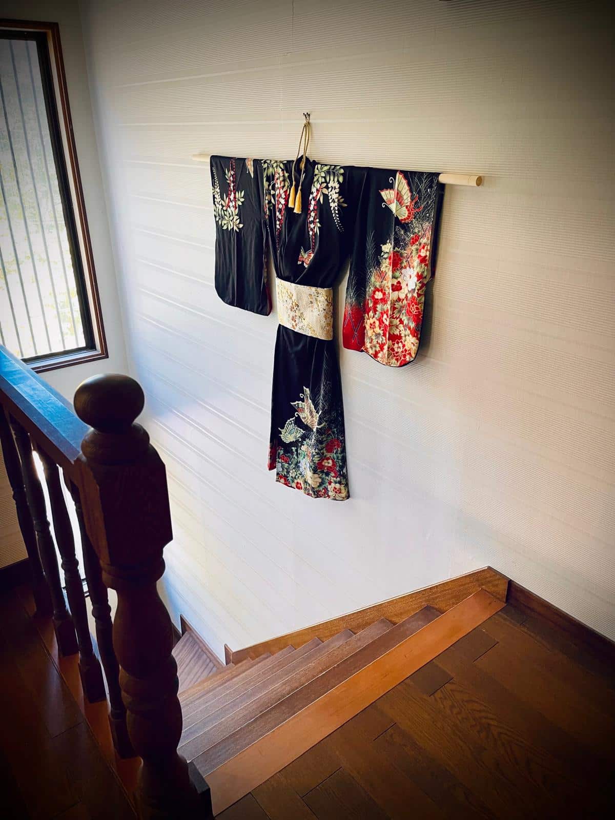 Omotenashi Inn kimono hanging on wall